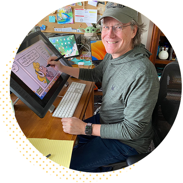 Illustrator working on a digital drawing tablet at a desk, smiling while creating a cartoon. The workspace features multiple screens and creative materials, showcasing a blend of technology and artistry.
