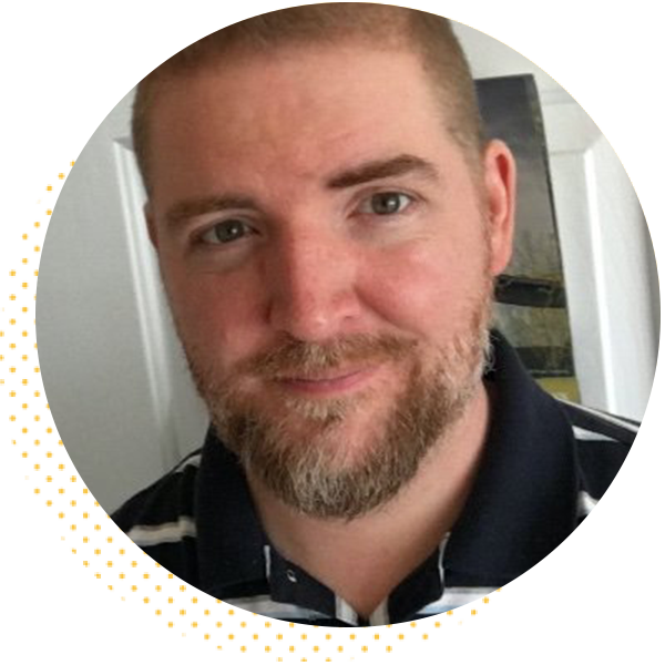 Smiling man with a beard, wearing a striped polo shirt, against a neutral background. Ideal for personal branding or professional profiles.