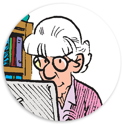 Elderly woman with white hair and glasses focused on a laptop, surrounded by books in a cozy setting, illustrating technology use by seniors.