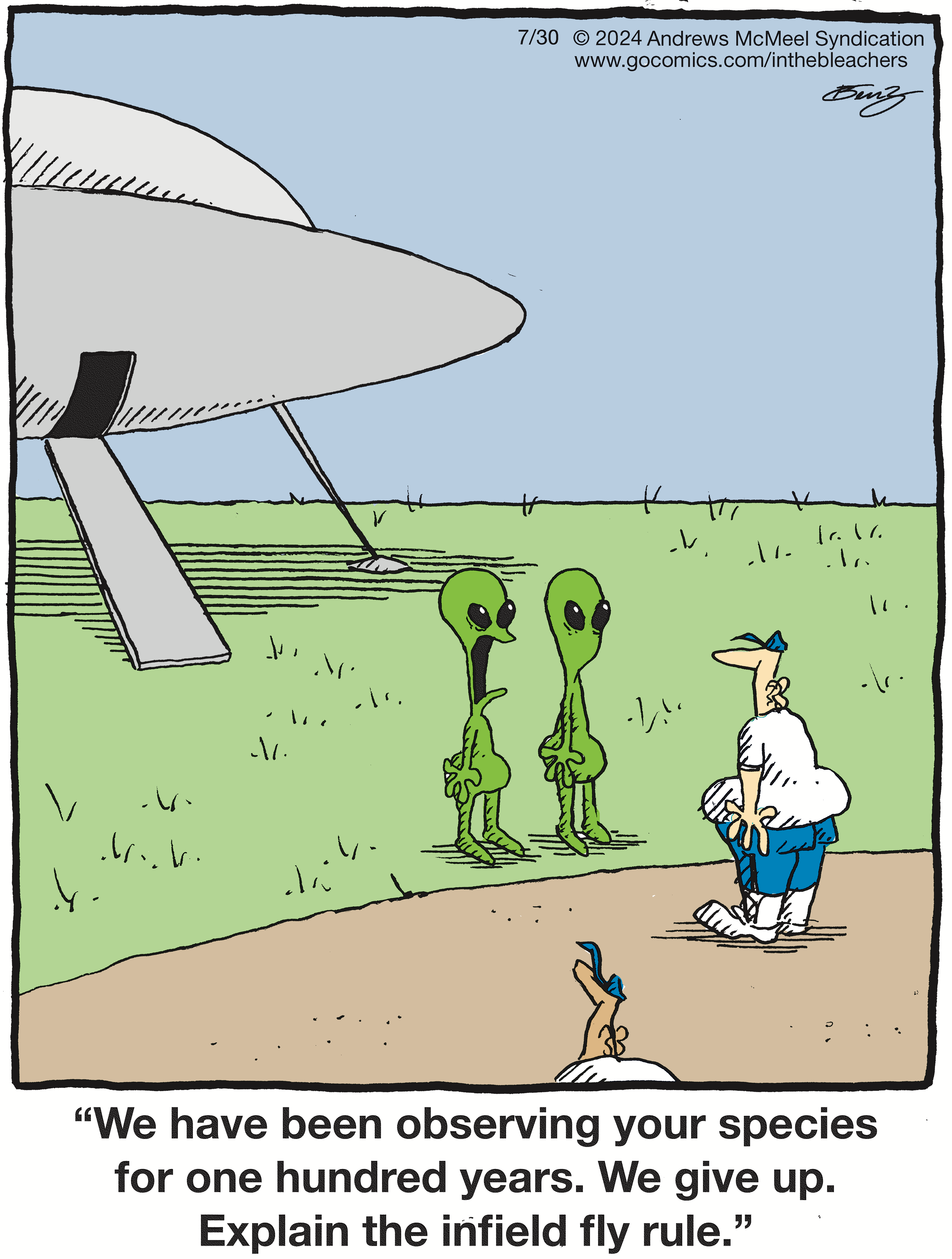 Two green aliens stand on a grassy field beside a spaceship, looking curiously at a human figure wearing a blue shirt and white pants. The scene captures a humorous interaction between extraterrestrial beings and a human in a cartoon style.